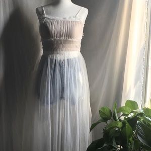 Sheer dress waits smocking and back button detail